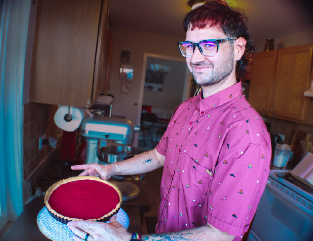 Displaying a beautiful cranberry and orange tart he made.